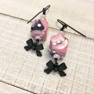 Pink and black swirled 6-side dice earrings
